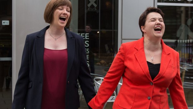 Scottish Conservative Leader Ruth Davidson (right) and her partner Jen Wilson leave a polling station in Edinburgh on Thursday.