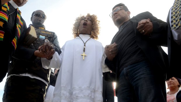 Dr Jeannetta Million of Victorious Believers Church leads a group of local pastors in a brief prayer vigil in San Bernardino.