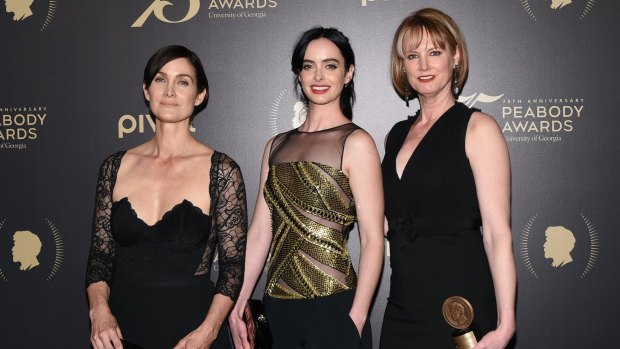 Jessica Jones actors Carrie-Anne Moss (left) and Krysten Ritter with creator Melissa Rosenberg.