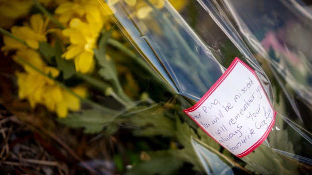 A floral tribute laid for Joseph Acquaro near his Brunswick East cafe on Wednesday.