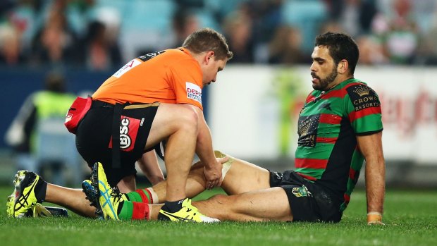 Concern: Souths star  Greg Inglis receives treatment during Friday's match against Canterbury before being forced to leave the field.