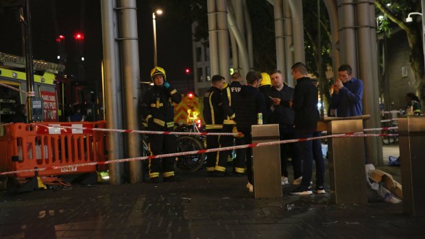 Emergency services at Stratford Centre in east London, following a suspected noxious substance attack in which at least six people were injured.