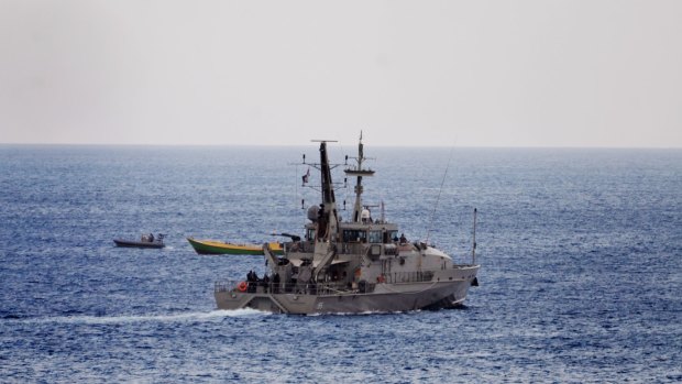 An Australian Navy vessel approaches a suspected refugee boat off the coast of Christmas Island last week.
