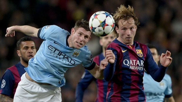 Ivan Rakitic and City's James Milner compete for the ball.