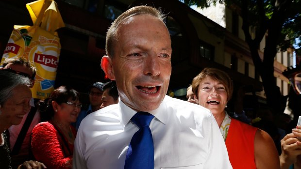 Prime Minister Tony Abbott takes a stroll through Chinatown at lunchtime on Sunday.