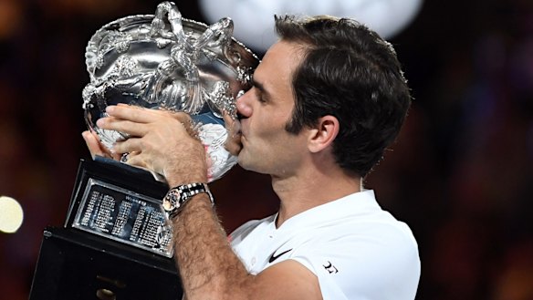 Roger Federer with the men's trophy.