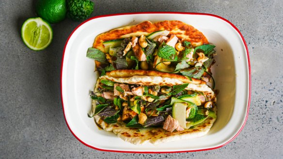 Flatbread piled with flaked hot smoked salmon, coriander dressing, cucumber, herbs and cashews.