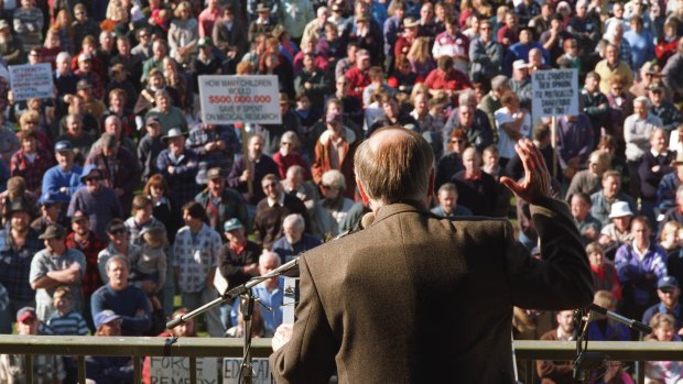 John Howard wears a bullet proof vest under his jacket as he addresses a gun control rally in Sale.
