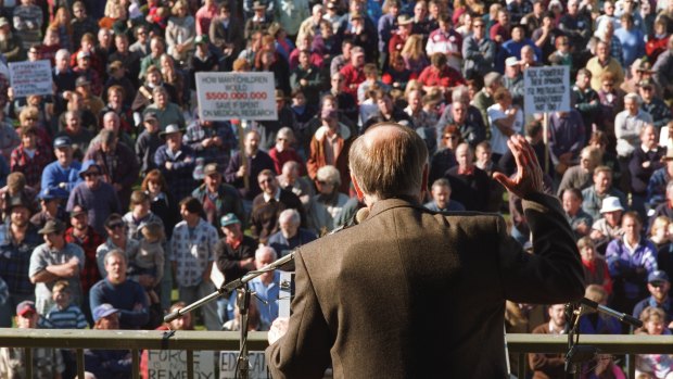 John Howard wears a bullet proof vest under his jacket as he addresses a gun control rally in Sale.
