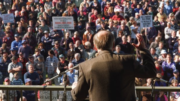 John Howard addresses a gun rally in Sale wearing a bullet-proof vest.