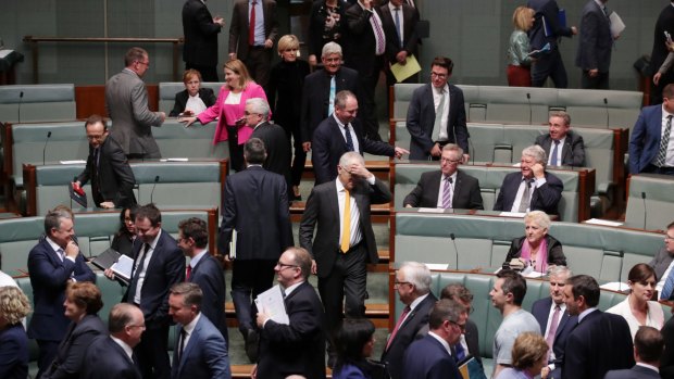 Prime Minister Malcolm Turnbull enters the House after his government lost a division 69-61.