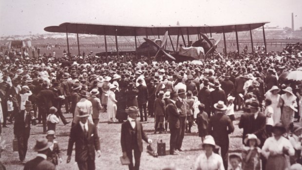 The Smith brothers' Vickers Vimy biplane greeted by a crowd at Mascot Aerodrome, 14 February 1920.