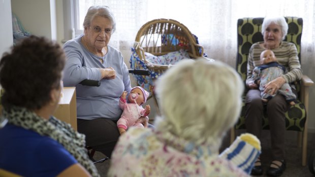 New hope: Mintie Hoskins (left) and Betty Wallace (right) participating in the the empathetic doll therapy program for dementia patients at the Uniting Mirinjani Weston.