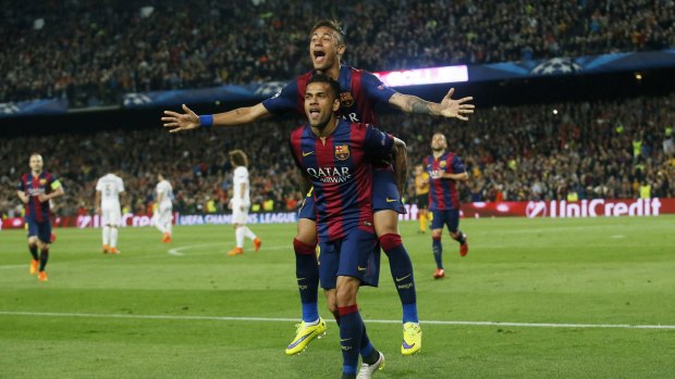 Neymar celebrates with Dani Alves after scoring the second goal for Barcelona.
