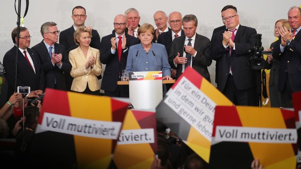 Germany's Chancellor Angela Merkel addresses her supporters and claims victory.