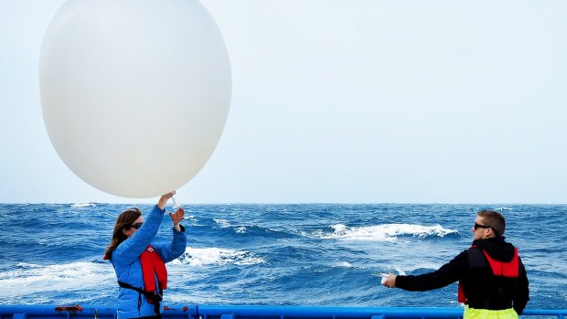 What goes up: Deploying weather balloons from CSIRO's RV Investigator.  