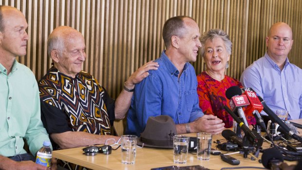 Peter Greste with his brother Mike (right) and Andrew (left) and parents Juris and Lois at a press conference in Brisbane.