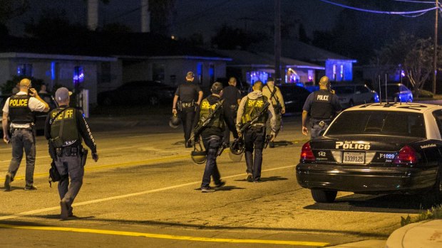 Authorities guard the perimeter near the location of the shooting in San Bernardino, on Wednesday.