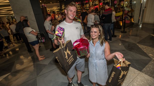 Lush customers Hugh Kirk and Laura Jennings of Sydney do their annual stock up at the Canberra Boxing Day sales.