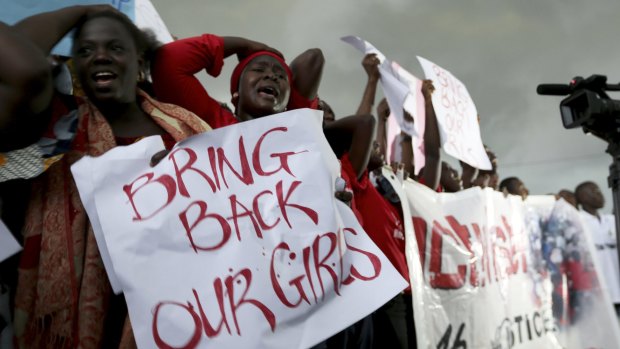Women react during a protest demanding security forces search harder for more than 200 schoolgirls abducted by Islamist militants in Nigeria in 2014.