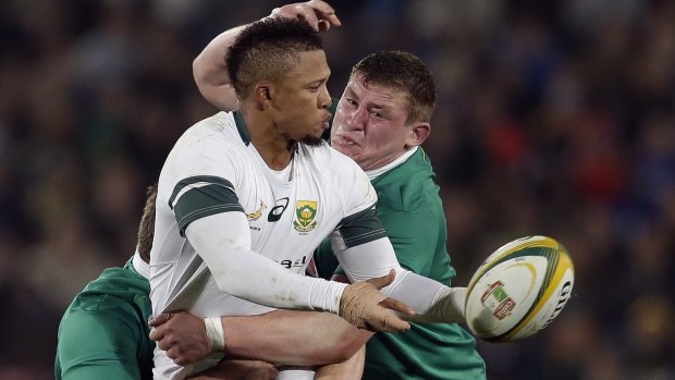 Offload: South Africa's Elton Jantjies is tackled by Ireland's Tadhg Furlong and Jack McGrath.
