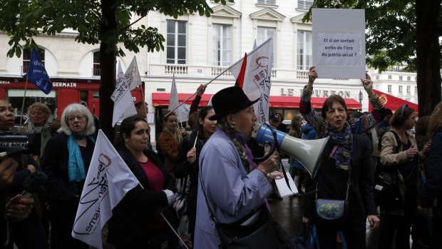 Feminist groups gather during a protest on Wednesday to demand an end to widespread sexism in French politics.