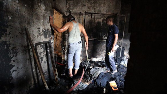 Iraqis search for people missing after a truck bomb hit Karada on Monday.