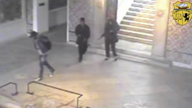 Two gunmen and a third unidentified man inside the Bardo museum.