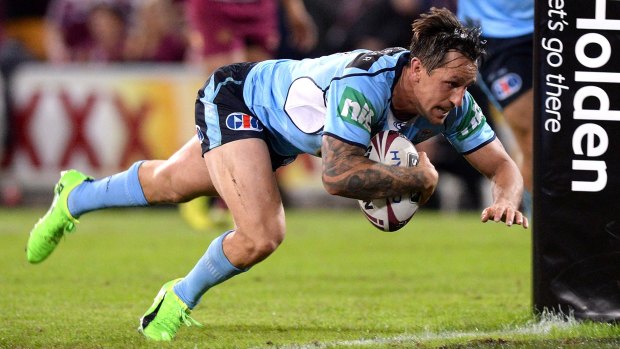 High intensity: Mitchell Pearce crosses the line for the Blues in Origin I this year.