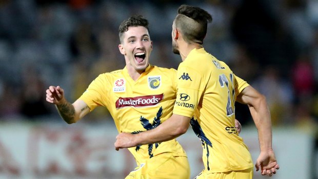 Happy new year: Storm Roux and Michael Neill celebrate a goal for the Mariners.