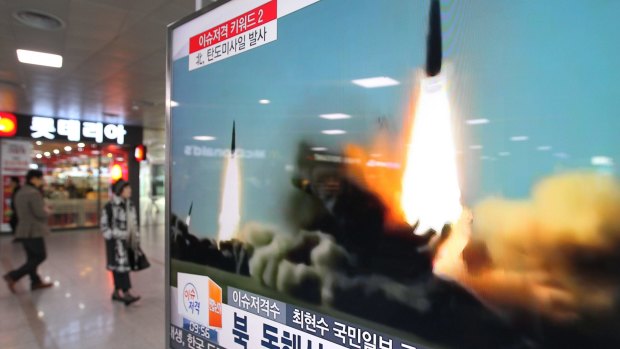A TV screen shows a file footage of the missile launch conducted by North Korea, at Seoul Railway Station in Seoul, South Korea.