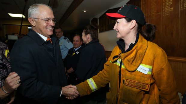 Mr Turnbull meets Kathy Taylor from the CFA Winchelsea Fire Brigade when attending a breakfast meeting in Geelong last week. 