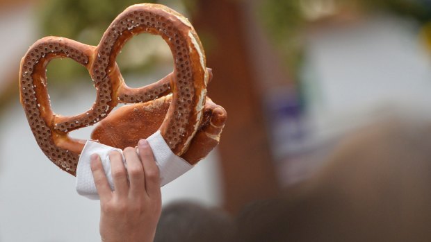 MUNICH, GERMANY - SEPTEMBER 19: A vendor holds a pretzel at the Hofbraeu tent on the opening day of the 2015 Oktoberfest on September 19, 2015 in Munich, Germany. The 182nd Oktoberfest will be open to the public from September 19 through October 4 and will draw millions of visitors from across the globe in the world's largest beer fest. (Photo by Philipp Guelland/Getty Images) Getty?