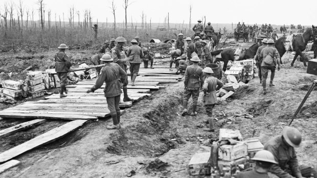 The 2nd Australian Pioneer Battalion making a wagon track from planks of wood at Chateau Wood during  the Battle of Passchendaele. 