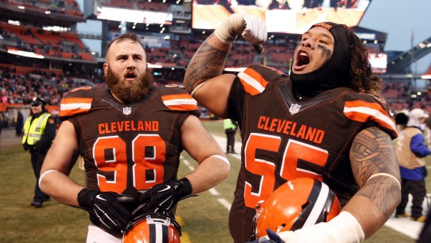 Sweet victory: Danny Shelton (55) and Jamie Meder (98) celebrate Cleveland's lone win last year.