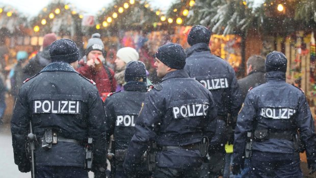 Police patrol the Christmas market in front of the city hall in Vienna in December. 