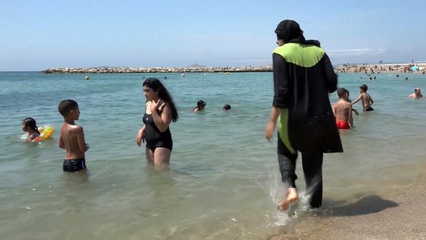 A woman wears a burkini at a beach in Marseille in southern France. 