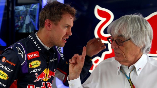 Sebastian Vettel and Bernie Ecclestone speak at the Russian Grand Prix.