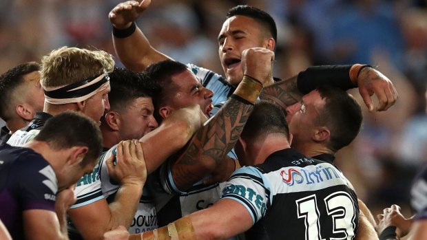 Sweet victory: Fifita at the centre of celebrations after the final whistle.