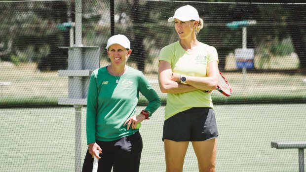 Fed Cup coach Nicole Pratt and captain Alicia Molik keep an eye on proceedings in Canberra on Monday.