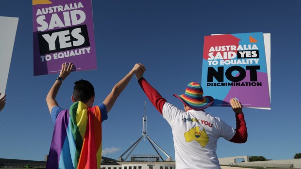 Supporters of same-sex marriage during a rally on the front lawn of Parliament House ahead of the vote on the Marriage Amendment Bill, at Parliament House in Canberra.