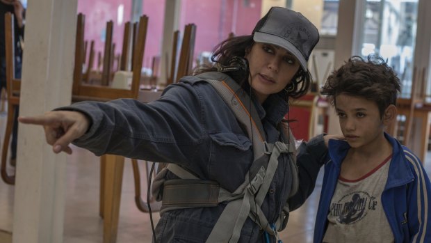 Director of Capharnaum Nadine Labaki behind the scenes with lead actor Zain Al Raffea.