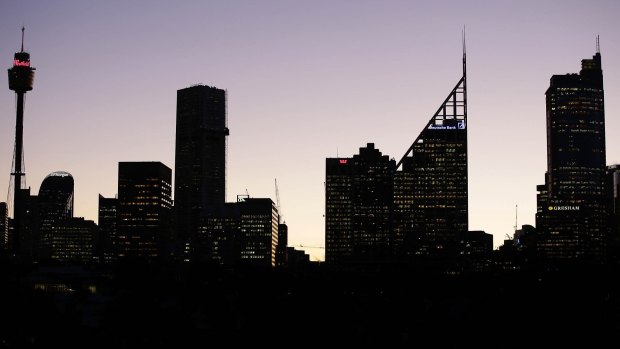 The Sydney CBD skyline at dusk. Office vacancy levels are falling, helped by the conversion of office towers into apartments.