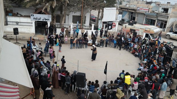 A shot from an IS propaganda website shows a street preaching event at Tel Abyad town in Raqqa province, north-east Syria. 