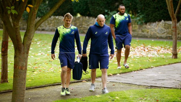Humble approach: Drew Mitchell, Stephen Moore and Sekope Kepu make their way to training. 