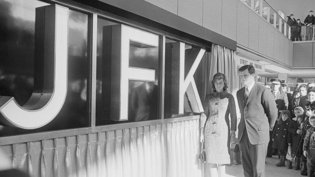 Senator Ted Kennedy and his sister Jean Smith stand next to a new JFK sign at the ceremony for the renaming of New York International Airport. 
