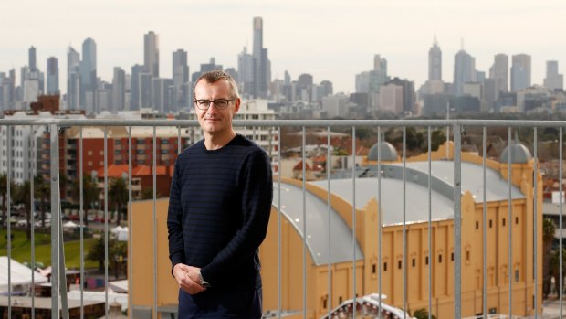 Great view: Resident Russell Jessop, who will give tours of Edgewater Towers apartment block next week, says the stunning views (from the roof, of Melbourne CBD in background, Palais Theatre in foreground) inspired him to move here.  