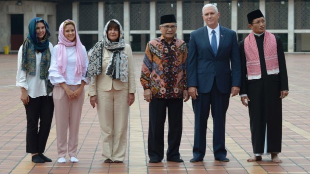 Mike Pence with, from left, his daughters Audrey and Charlotte, wife Karen and dignitaries at the Istiqlal Mosque, Jakarta.