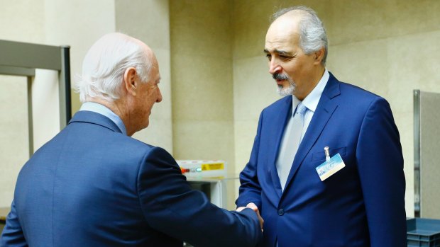 UN Special Envoy for Syria Staffan de Mistura, left, greets Syrian government negotiator Bashar al-Jaafari for a meeting during Intra Syria talks at the UN in Geneva on Tuesday.