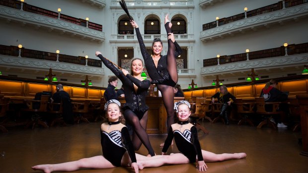 Calisthenics girls: Emily Smith (Back left), Angel Cray (Back right), Adelaide Carthew (front left) and  Liza Williams (front right) try out the State Library of Victoria dome where they will perform on August 18. 